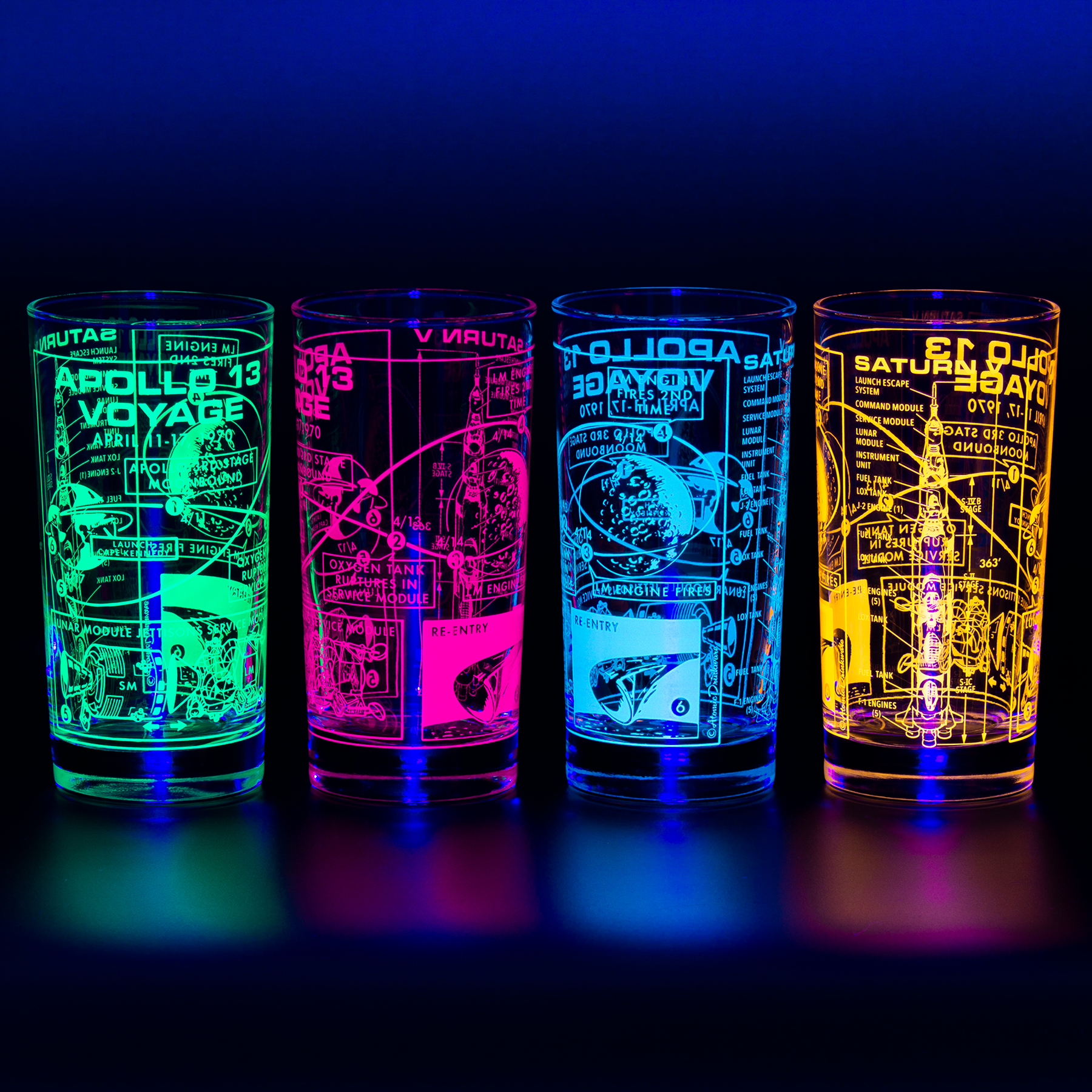 Four UV Apollo 13 glasses in blacklight with space-themed designs on a dark background