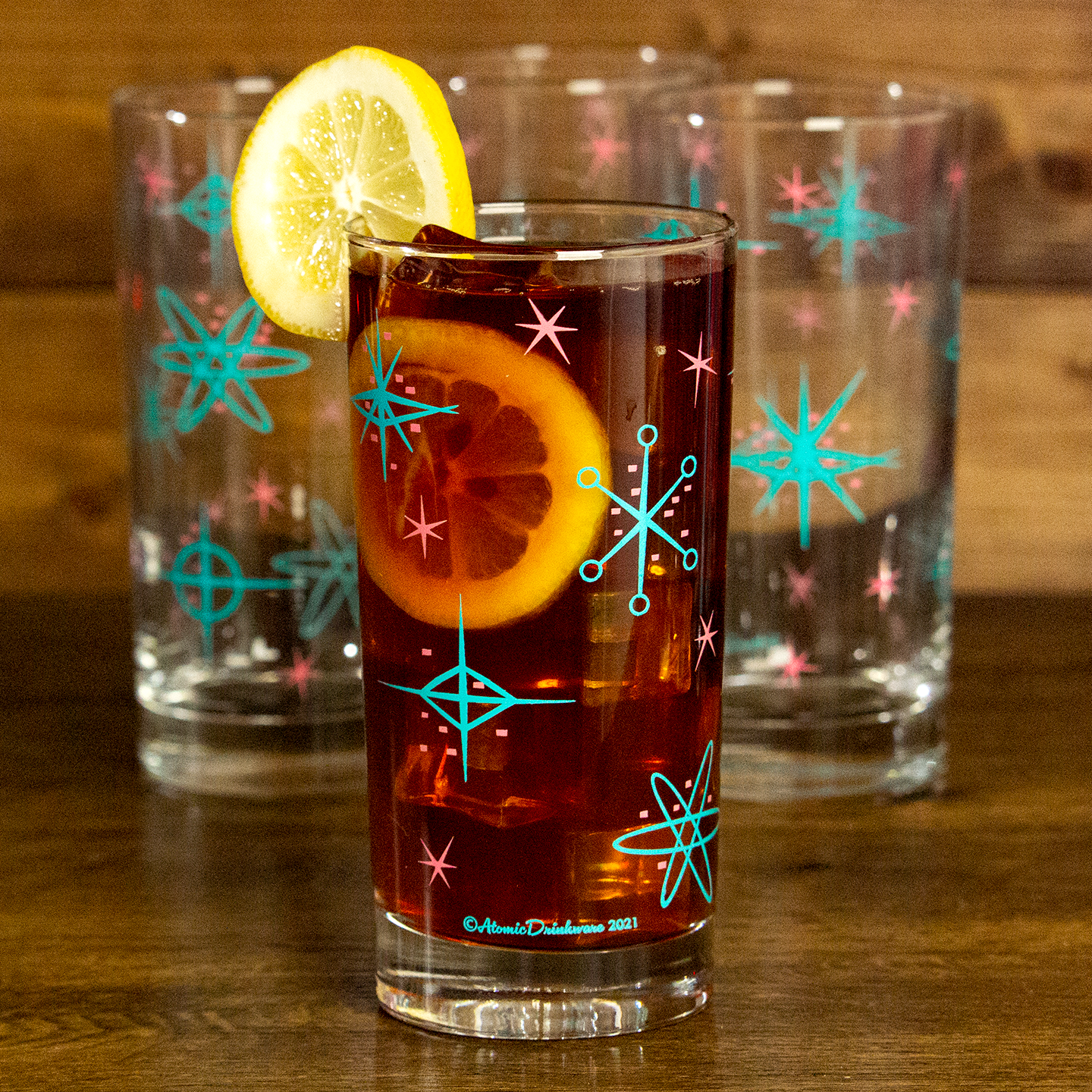 Clear glasses with retro star and circle atomic designs for home entertaining and collecting