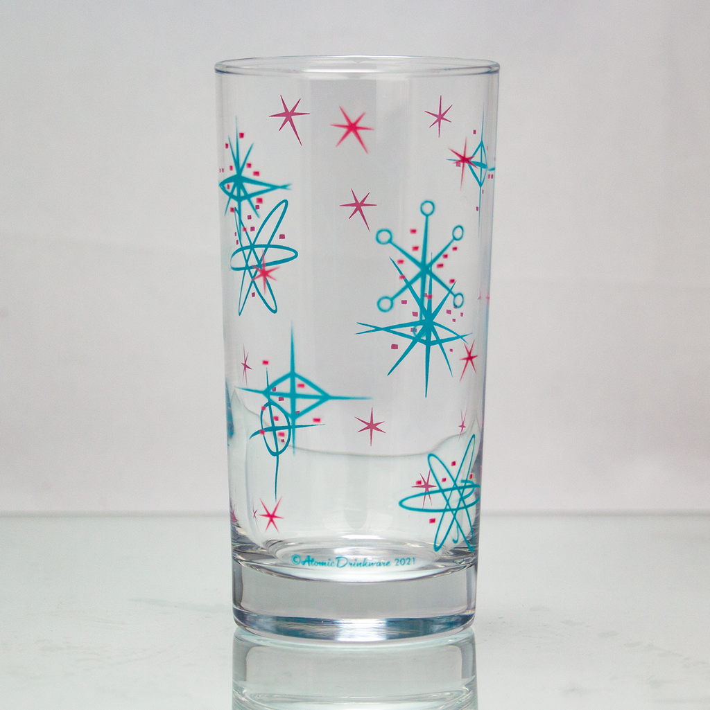 Atomic style retro glass with blue and pink starburst patterns on a white background