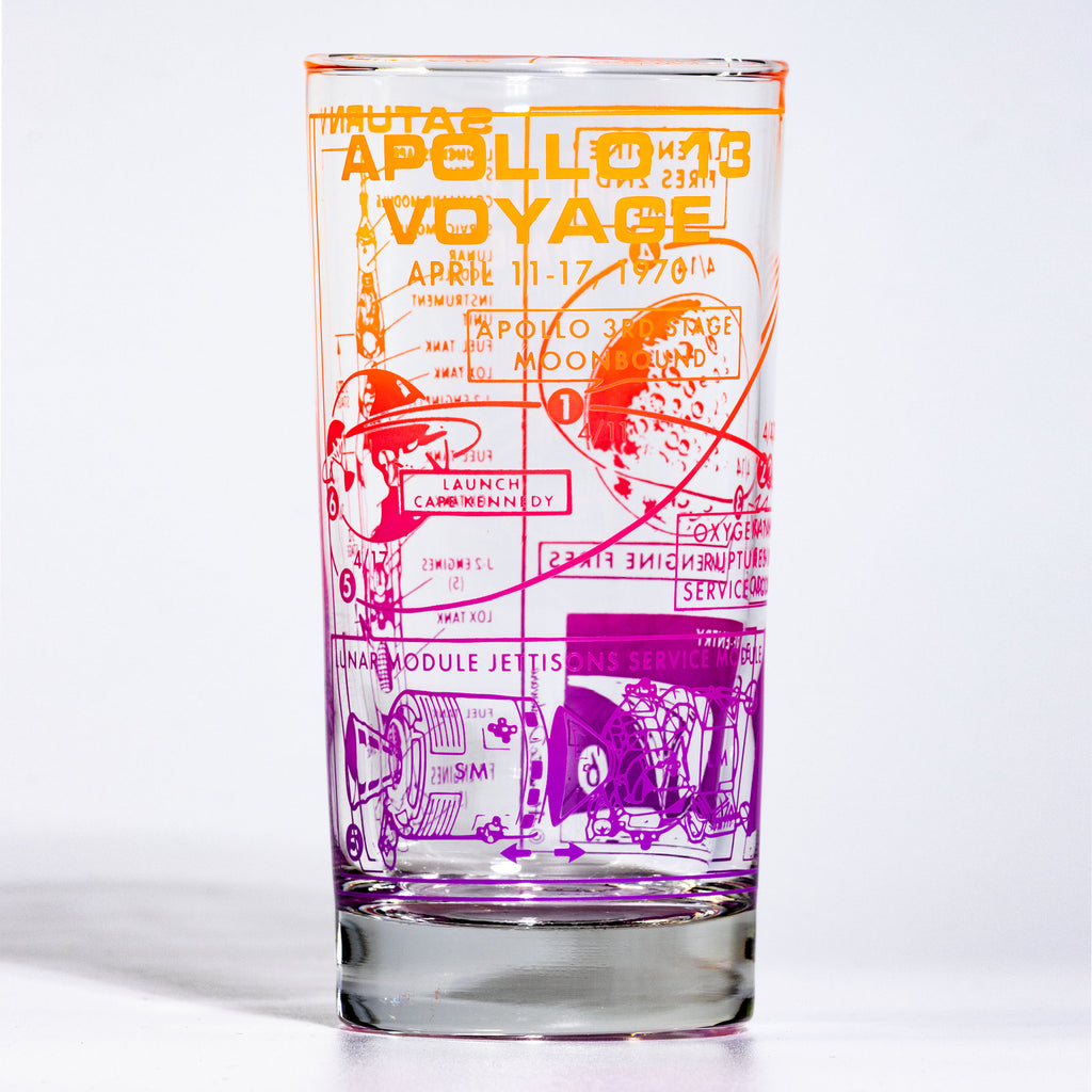 Glass tumbler with Apollo 11 mission graphic design on a white background
