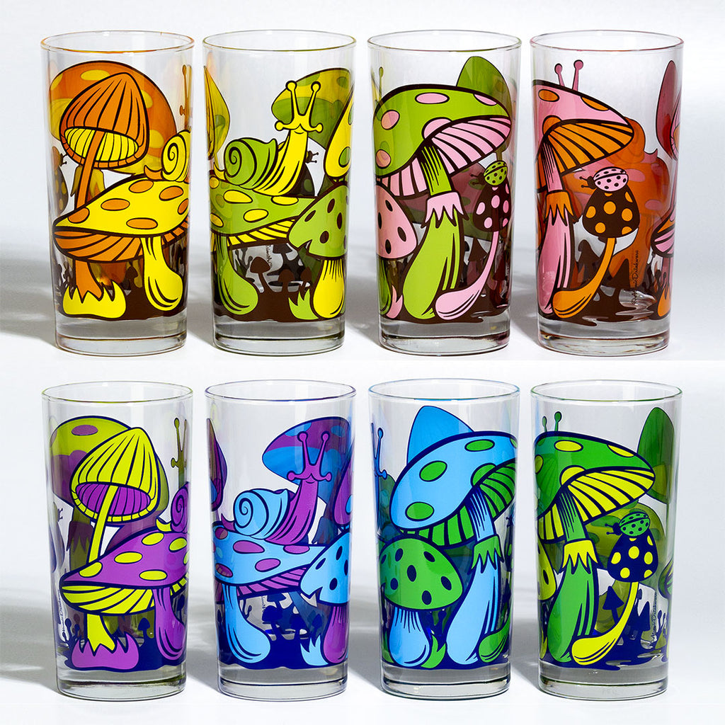 Set of colorful mushroom-themed glasses on a white background