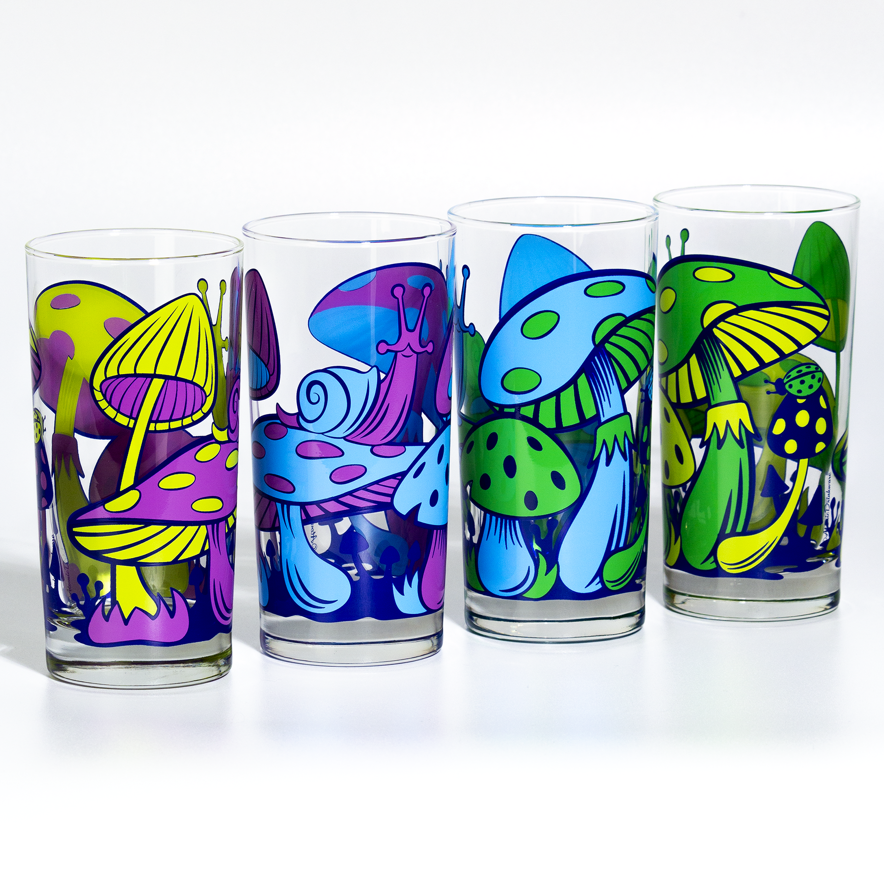 Set of colorful glass tumblers with retro mushroom and abstract designs on a white background