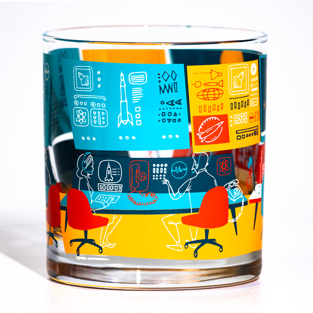 Glass with colorful design featuring retro space mission control room on a white background