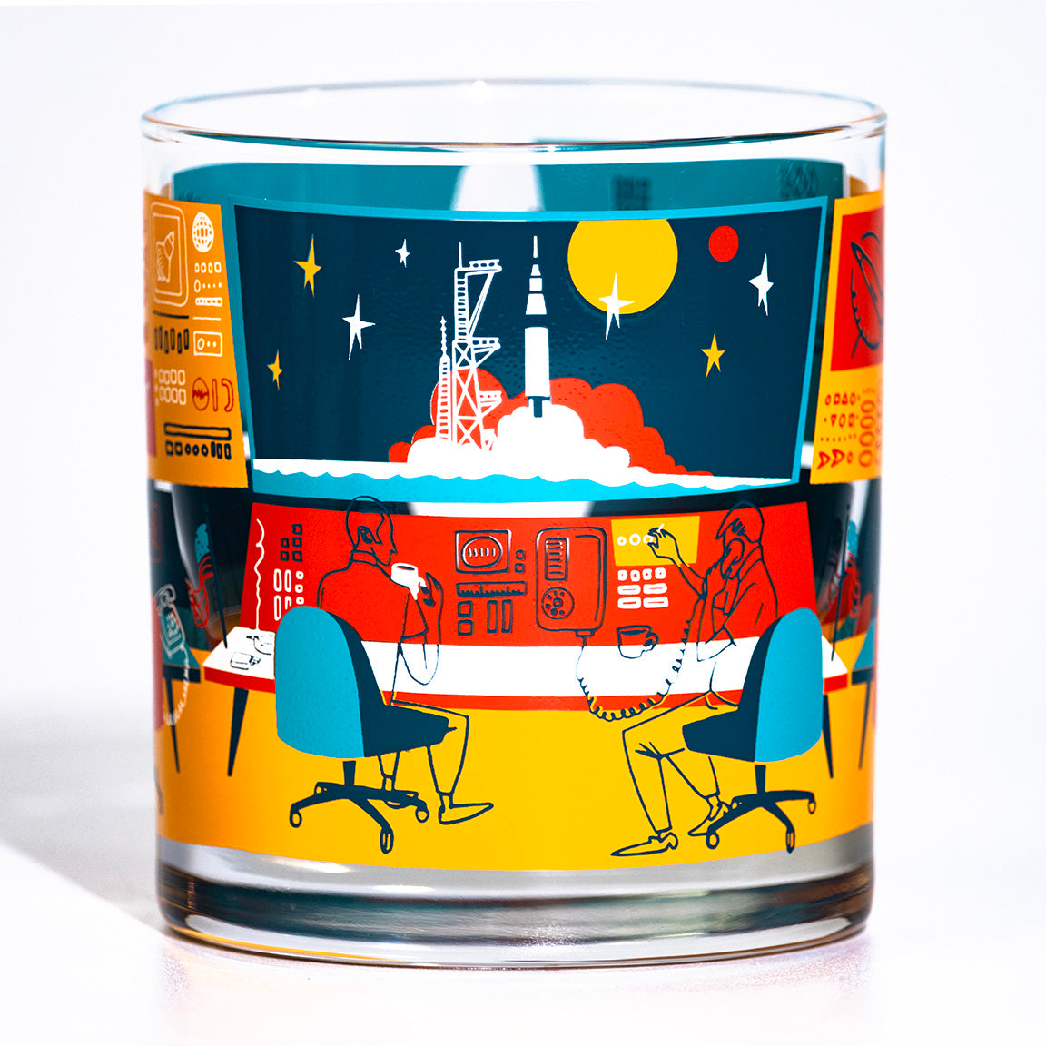 Glass with colorful design featuring retro space mission control room and rocket launch on a white background