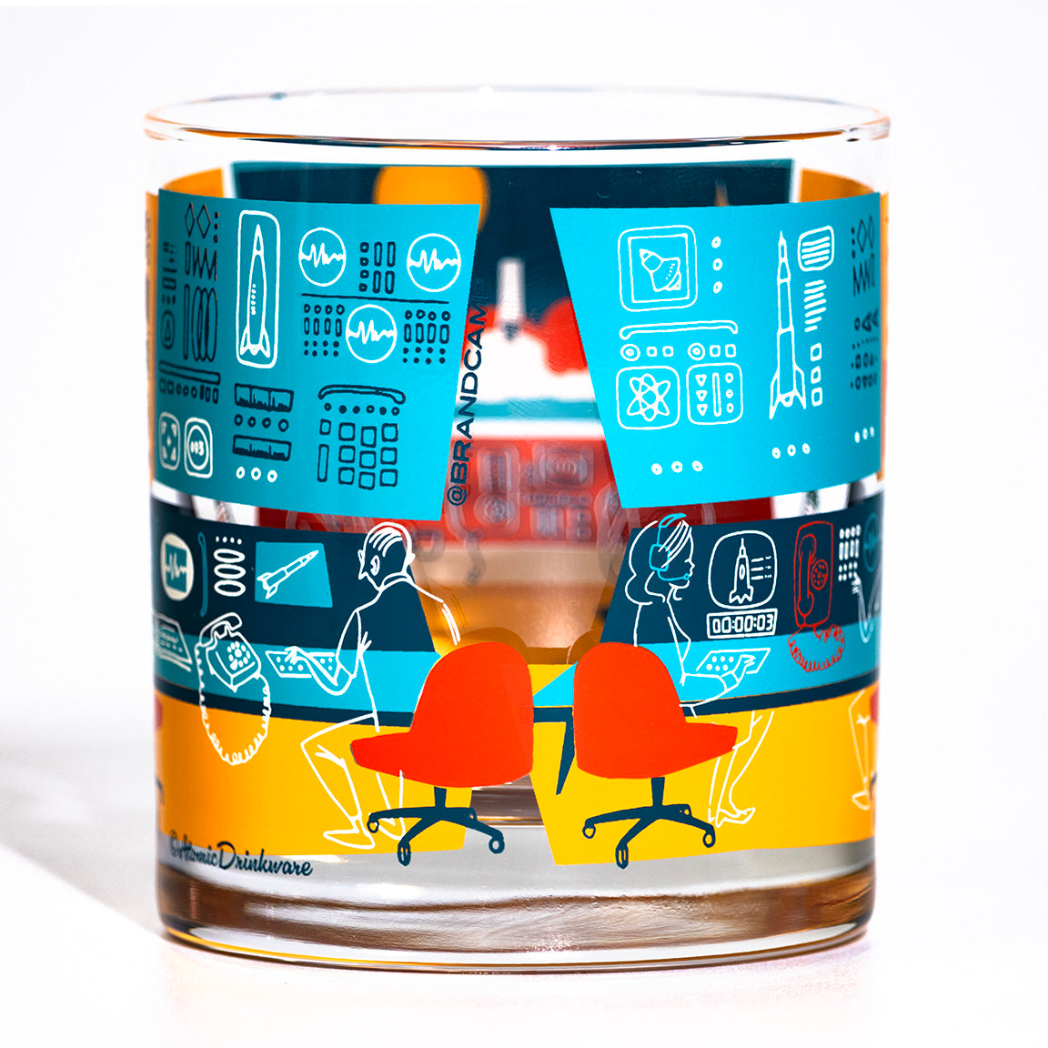 Glass with colorful design featuring retro space mission control room on a white background