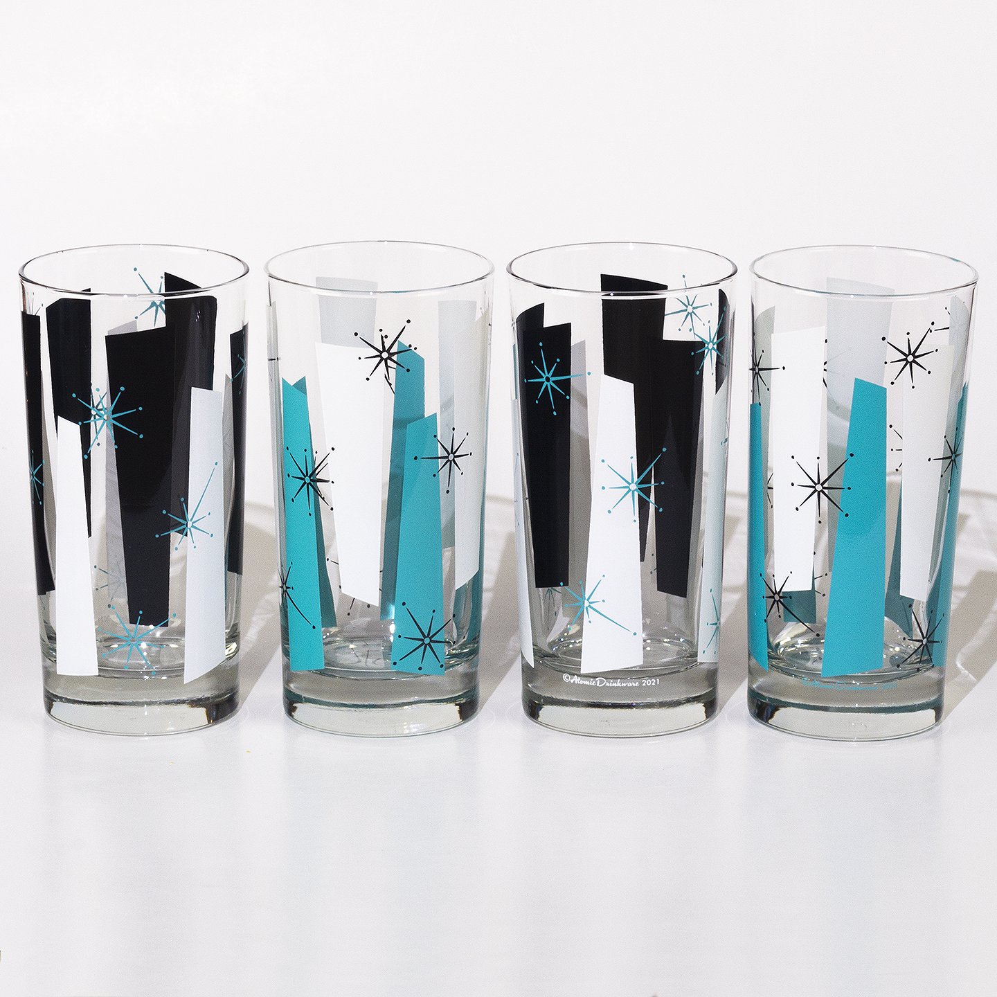 Four rock a billy retro glass tumblers with mid century modern design for cocktails and mocktails