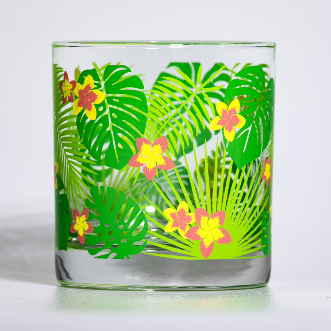 Retro atomic barware with tropical palm leaf and flower design on a white background