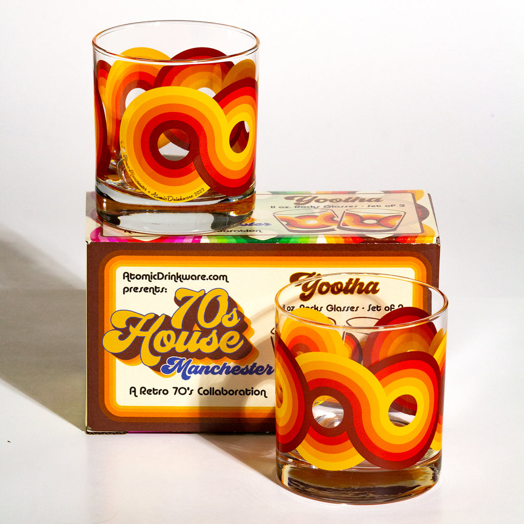 Two retro-style glasses with colorful design on a white background, featuring '70s House Manchester' packaging.